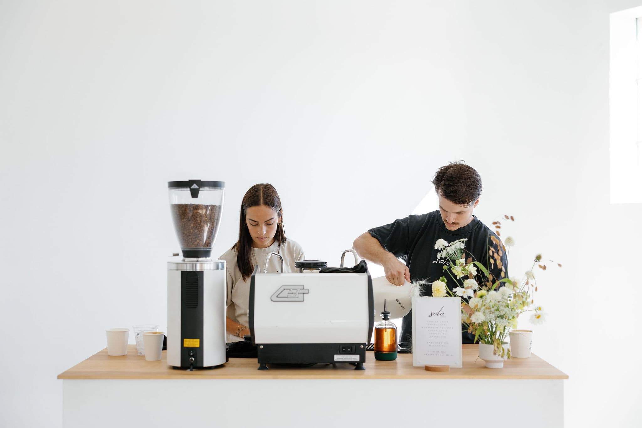 Professional baristas crafting coffee