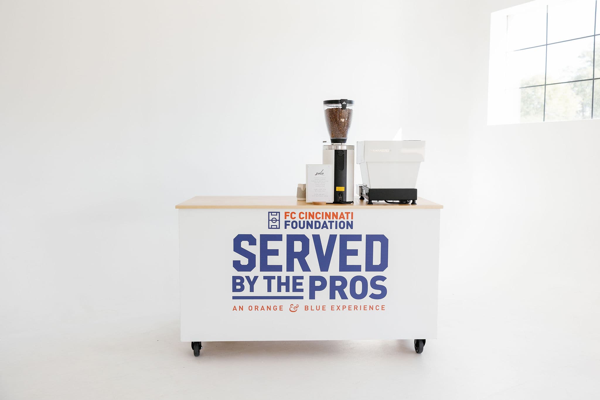 Custom branded coffee cart with FC Cincinnati Foundation branding